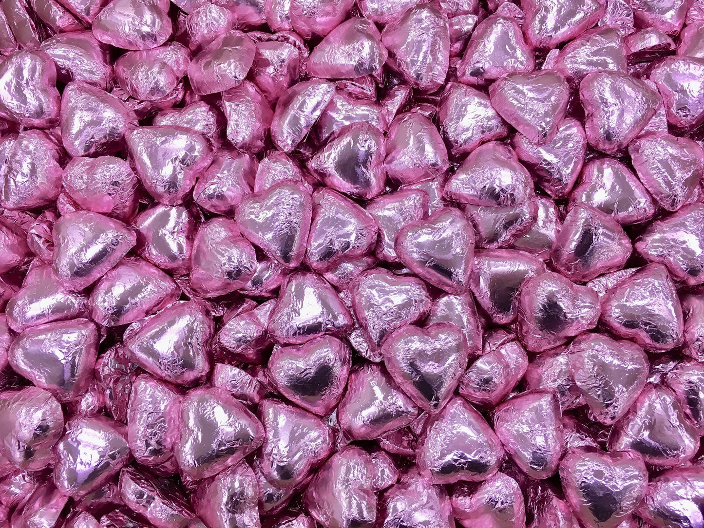 Toms Choc Hearts 1kg light pink foiled in cello bag